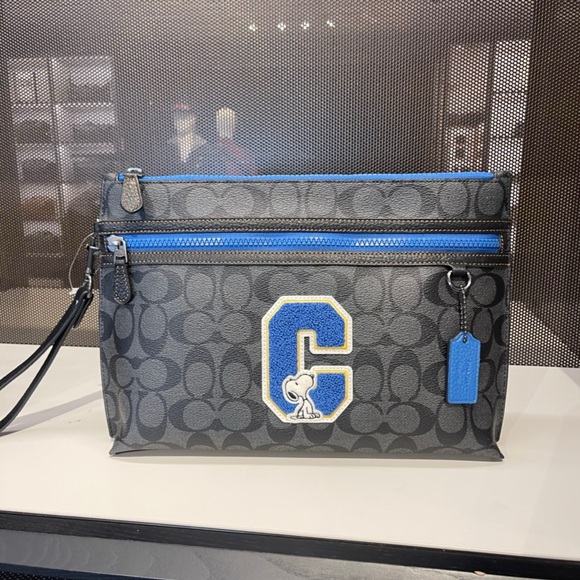 Coach X Peanuts Carryall Pouch In Signature Canvas With Snoopy